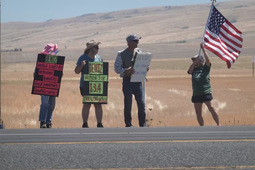 Several people protest Cliff Bentz's speech in front of the Wildhorse Resort and Casino near Pendleton, Ore., on July 25, 2025.