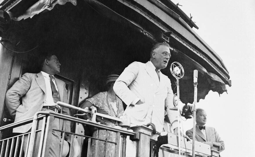 President Franklin D. Roosevelt at Fort Peck, Mont., in August 1934 as he made one of his numerous addresses from the observation platform of his train during his journey over the parched plains of the Northwest.