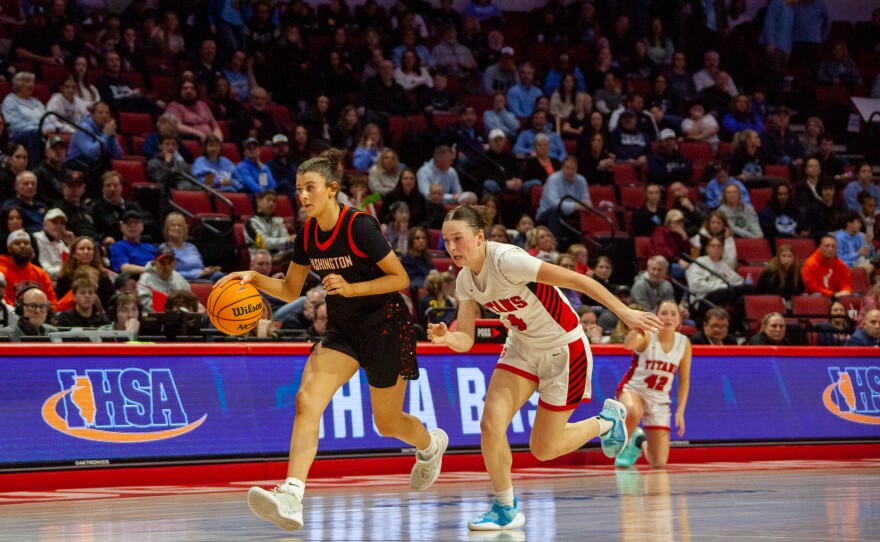 Girls high school basketball players inside an arena