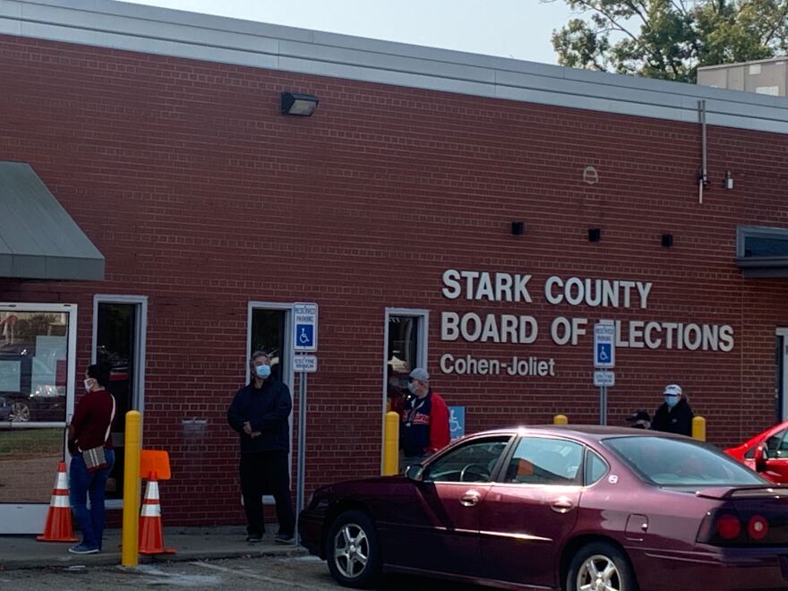 Voters wait outside the Stake County Board of Elections to vote on the first day of in-person early voting for the 2020 elections.