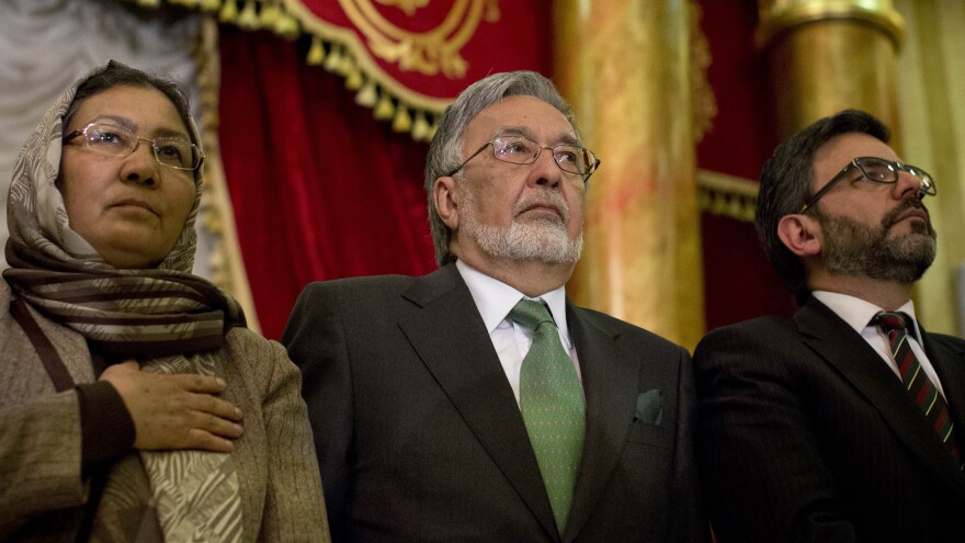 Presidential candidate Zalmay Rassoul (center) has chosen a woman, Habiba Sarobi, as his vice presidential running mate. Other leading contenders in Saturday's election have also made some surprising vice presidential picks as they attempt to broaden their appeal.