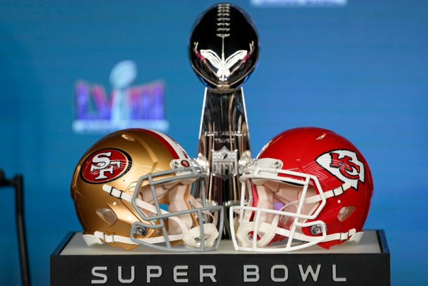 Super Bowl LVIII helmets and trophy on display
