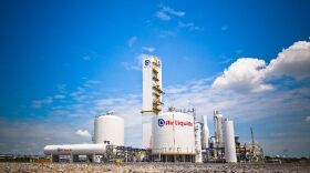 Air Liquide industrial gas facility in Louisiana with storage tanks and air separation unit equipment under blue sky.