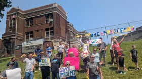 Residents, staff and students protest outside Kenmore Elementary, asking Akron Public Schools to move forward with building a new school in their neighborhood after years of closures.
