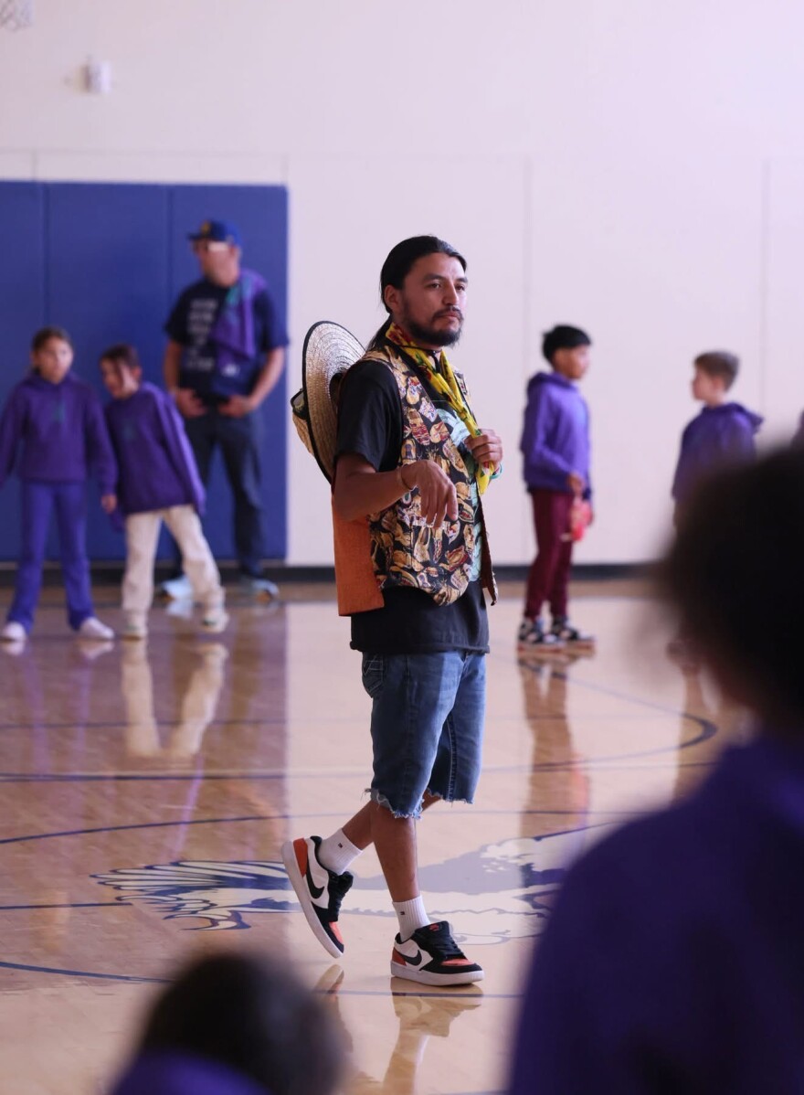 Language teacher Louis Bates of Spokane Language House presents during the Wellpinit School District's Walk for Life. Bates and Spokane Tribe Suicide Prevention Coordinator Rachel Ferguson work together to deepen students' connection to Indigenous languages and cultures as one part of the behavioral health programming at WSD.