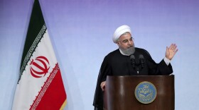 In this photo released by the official website of the office of the Iranian Presidency, Iran's President Hassan Rouhani speaks during a ceremony marking the beginning of new Iranian academic year at the Tehran University, in Tehran, Iran, Saturday, Oct. 7, 2017. Iran's president on Saturday defended the 2015 nuclear deal with world powers, saying not even 10 Donald Trumps can roll back its benefits to his country as President Trump appears to be stepping back from his campaign pledge to rip up the deal, instead aiming to take other measures against Iran. (Iranian Presidency Office via AP)