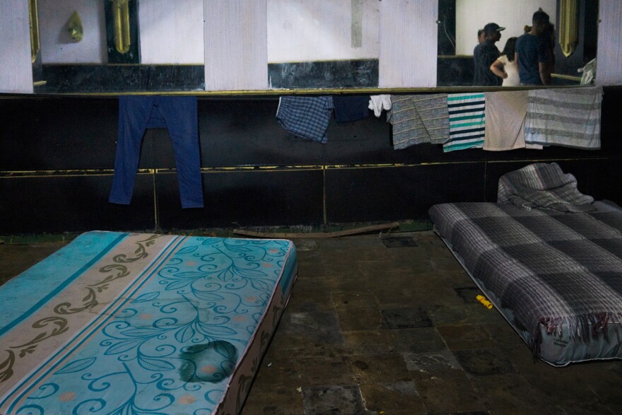 Mattresses line the floor of a hotel basement in Juárez, where migrants are waiting to enter the U.S. Many crossed the border and were then returned to Mexico as part of the "remain in Mexico" policy.