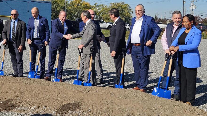 Local political and business leaders greet one another after the groundbreaking for a 96,000 square-foot addition at Niagara Power Transformer.