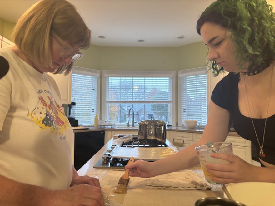 Ana Veros and her mom, Wendy, work together down the tiropita assembly line.