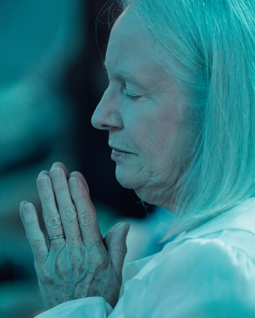 Diane Heckley, of Bloomington, Indiana, prays ahead of the beatification Mass for the late Archbishop Fulton J. Sheen on Thursday at The Dome at America's Center. "I remember him on television," she said. "It's just a feeling of grace and closeness to our Lord."
