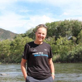 Mina Guli stands at the banks of the Colorado River in Glenwood Springs on June 26, 2026. She’s running the length of the river in a campaign to raise awareness and drive action to address its drought crisis.