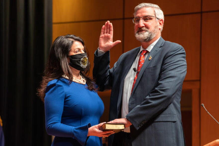 Gov. Eric Holcomb, alongside his wife Janet, is sworn in for his second term as Indiana governor.
