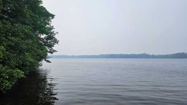 Canadian wildfire smoke creates a haze seen across Lake Julia in Oneida County.