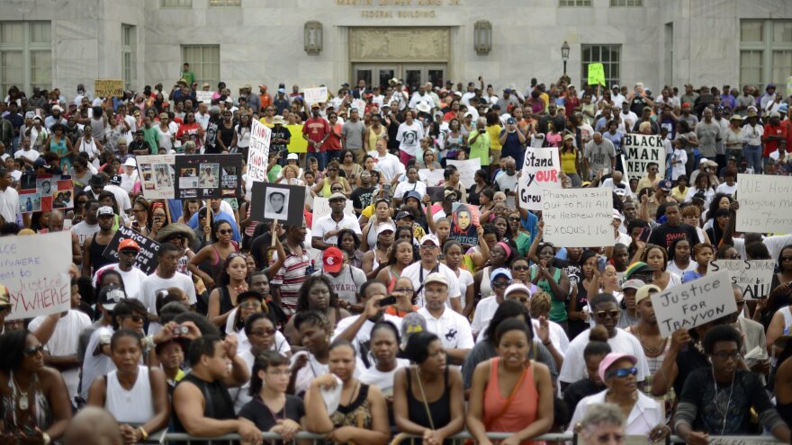 A crowd gathers for a rally in protest of the not-guilty verdict for George Zimmerman in Atlanta on Saturday.