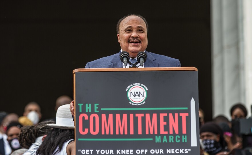Martin Luther King III, center at bottom, speaks Friday at the Lincoln Memorial during the event dubbed "Get Your Knee Off Our Necks" in Washington.