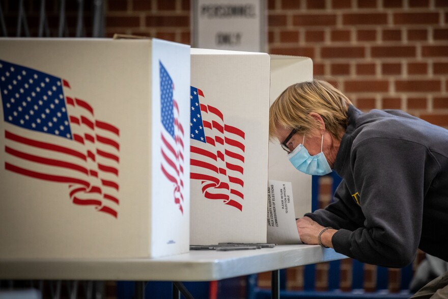 A man fills out his ballot in Des Moines, Iowa.
