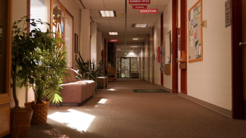 Sunlight shines through windows in a hallway of the Benny Benson Building at Kodiak College