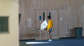 A voter casts a ballot at St. Edward’s University on Nov. 3, 2020.