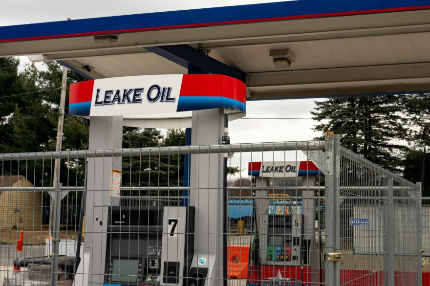 The pumps and convenience store at the gas station remain fenced off.