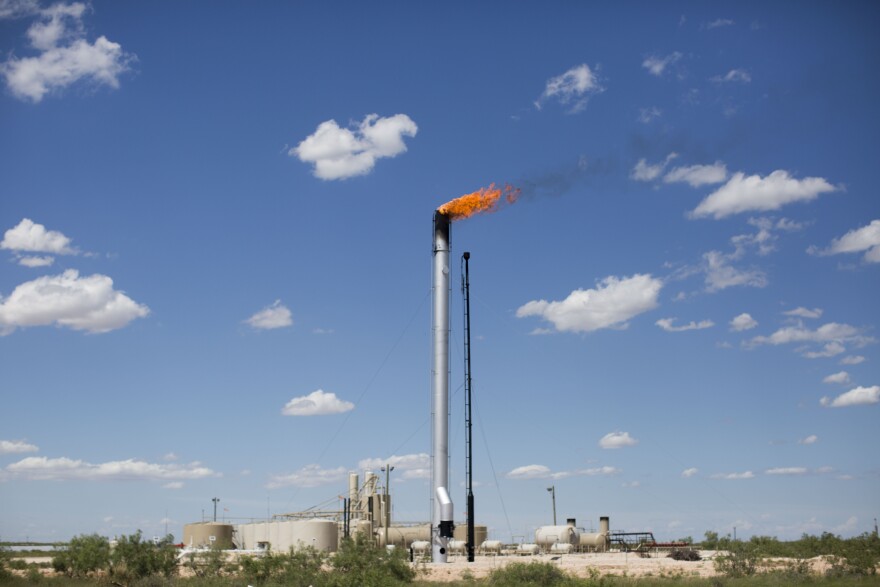 Gas is burned off from an oil well in West Texas.