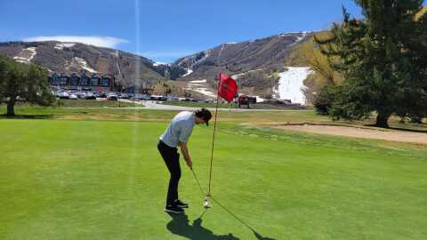 Person golfs at the Park City golf course on March 28, 2026.