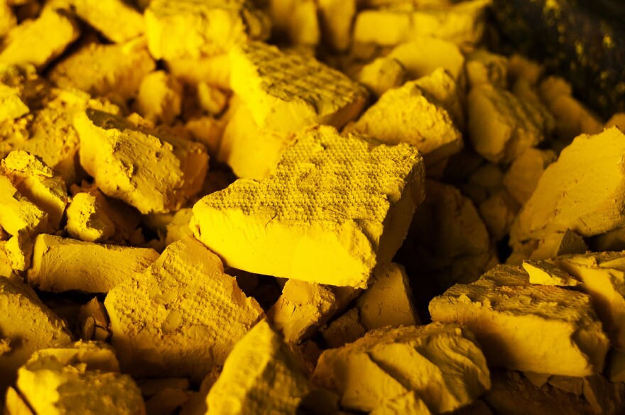 "yellow cake uranium" is produced from uranium ore. The element in this form must go through further processing before it is able to be used as nuclear fuel.