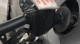A pump fills the gas tank on a vehicle at a Peoria gas station. 