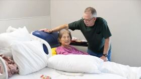Mike McGuire talks with his wife, Kim McGuire, during her stay at Rural Wellness Stroud hospital in Stroud on April 21, 2026. It's one of several rural hospitals finding ways to adapt and avoid closure.