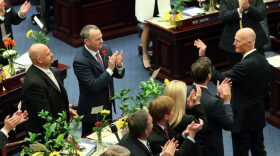 Florida Gov. Rick Scott, right, waves as he is recognized by the house of representatives at the start of the legislative session, Tuesday, Jan.12, 2016, in Tallahassee, Fla. (AP Photo/Steve Cannon)