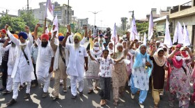 Farmers shout anti-government slogans as they march during a protest in Amritsar, India, Friday, Sept. 25, 2020. (AP Photo/Prabhjot Gill)