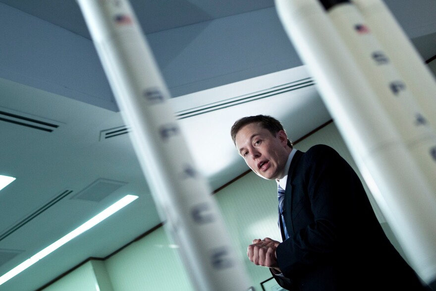 Elon Musk, CEO of SpaceX, announces the Falcon Heavy rocket at a 2011 news conference in Washington, D.C.