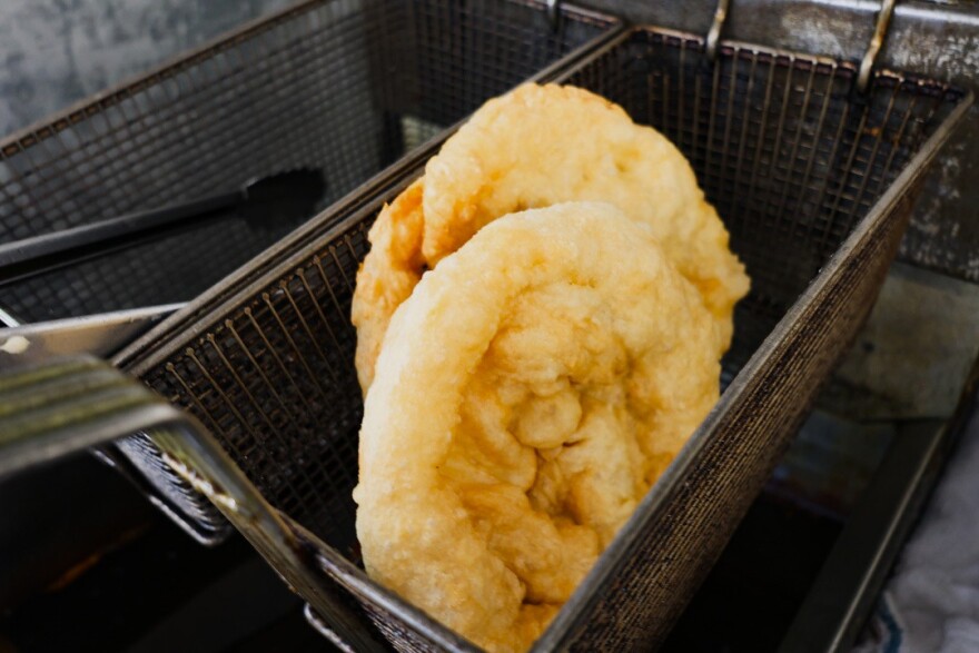 Freshly cooked fry bread cools off in a basket.