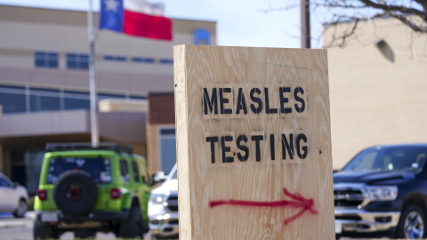 FILE - A sign is displayed outside the Seminole Hospital District offering measles testing, Feb. 21, 2025, in Seminole, Texas.