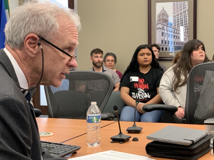 Tulsa City Councilor and mayoral candidate Jayme Fowler speaks on his proposed ordinance barring public money from assisting undocumented immigrants as YWCA worker Amanda Sibrian looks on Wednesday, Feb. 21, 2024, at Tulsa City Hall.