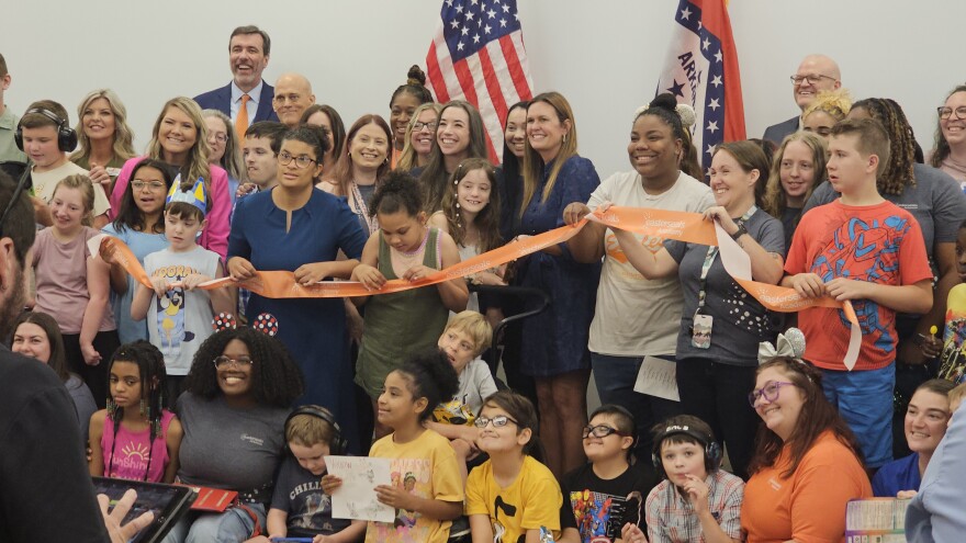 Governor Sarah Huckabee Sanders, with students and staff, cut the ribbon to Easterseals Arkansas Academy in West Little Rock