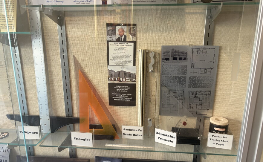Inside the entrance of the Milwaukee Fire Department headquarters, there's a display case with photos, tools, and other memorabilia dedicated to Alonzo Robinson Jr.