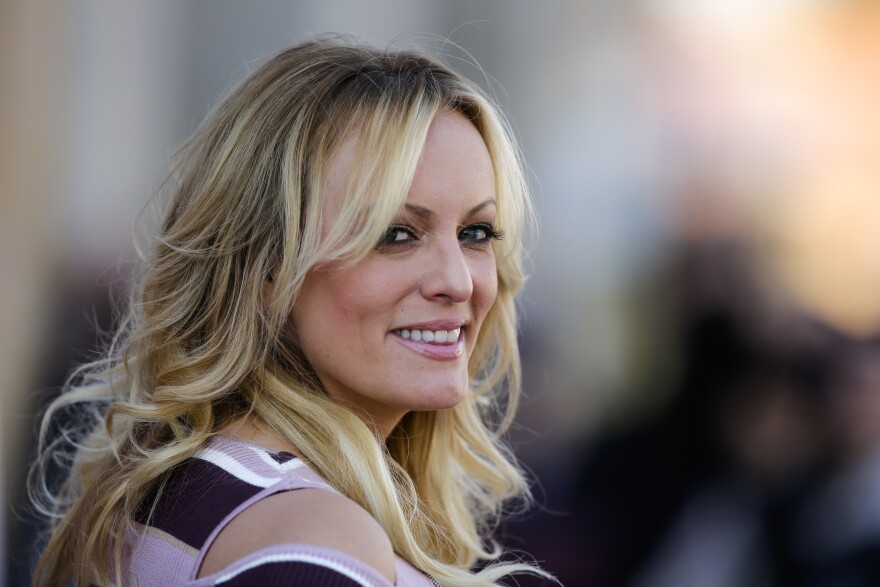 In this Oct. 11, 2018, file photo, adult film actress Stormy Daniels attends the opening of the adult entertainment fair 'Venus' in Berlin, Germany. 