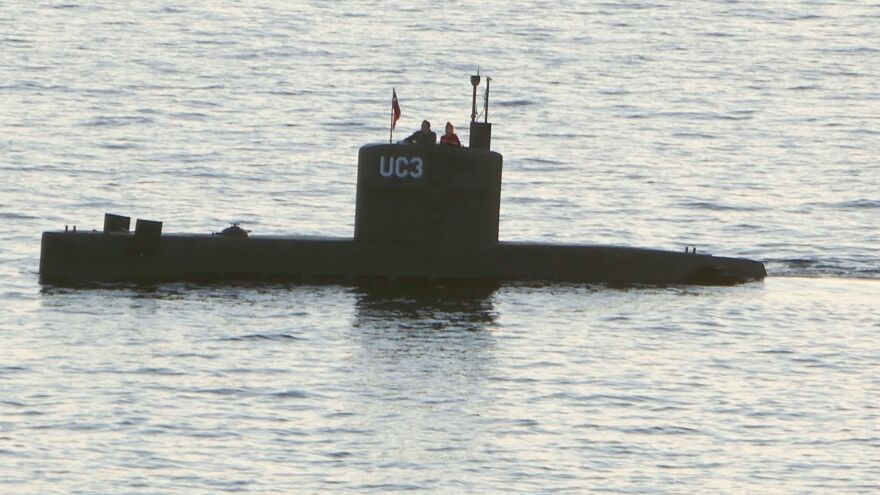 This photograph allegedly depicts Danish inventor Peter Madsen and Swedish journalist Kim Wall standing in the tower of Madsen's private submarine on Aug. 10, shortly after they left Copenhagen's harbor.