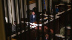 House Speaker-elect Kyle Hilbert, R-Bristow, sits at the head of the House of Representatives chamber and smiles at a fellow lawmaker during the House’s swearing-in ceremony, Nov. 20, 2024, at the Oklahoma State Capitol. Hilbert is the youngest representative to serve in the Oklahoma House’s top leadership position in state history.