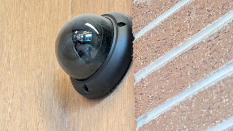 A mounted security camera at the East Avenue Wegmans in Rochester