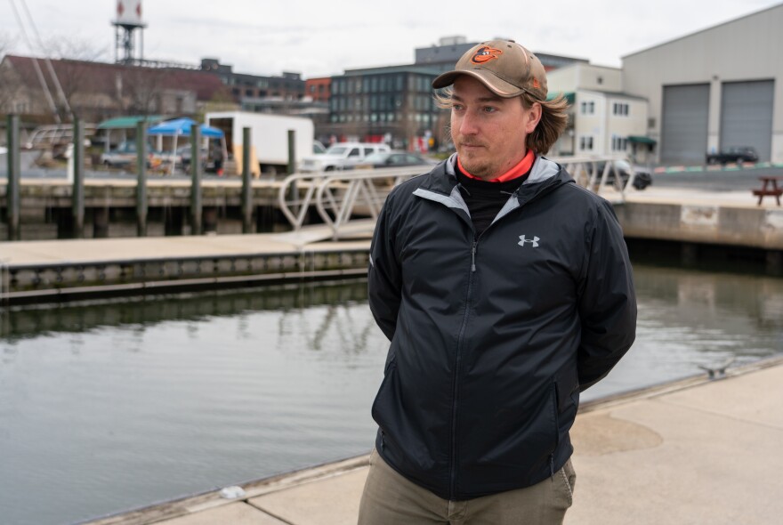 Alex Snider manages waterfront operations for MAG Partners, the company that's redeveloping Baltimore Peninsula. He wore his Orioles cap at the Port Covington Marina on Thursday, baseball's opening day.