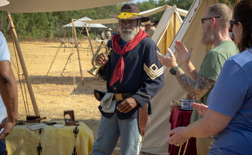 Buffalo Soldier reenactor after playing a bugle, photo by Alexander Brown.