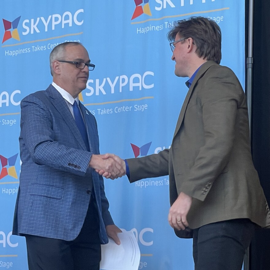 Jeff Reed (left), founder and director of Orchestra Kentucky and the Ramsey Theatre Company orchestra for 26 years, congratulates his successor, Joseph Trafton Jr., during a ceremony held Thursday at the Southern Kentucky Performing Arts Center (SKYPAC). Trafton will oversee “artistic leadership” for Orchestra Kentucky's concert programming and will serve as Music Director for the Ramsey Theatre Company, according to a release.