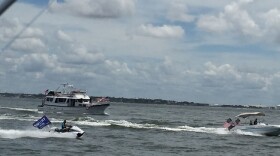 three boats bearing U.S. and Trump flags