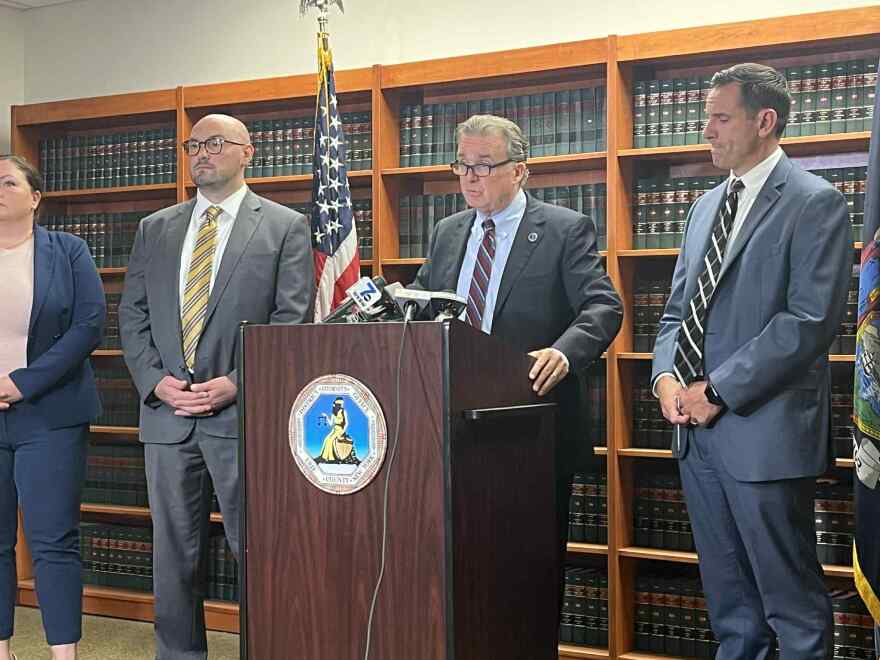 Erie County District Attorney Mike Keane (center, at lectern) announcing a new indictment against Rickey Crouch, who's accused of shooting and killing his ex-girlfriend. Keane also pushed back on talk from some politicians that New York's bail laws played a factor in her death.