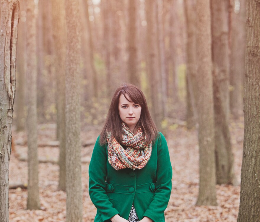 Headshot of Katie Else in the woods