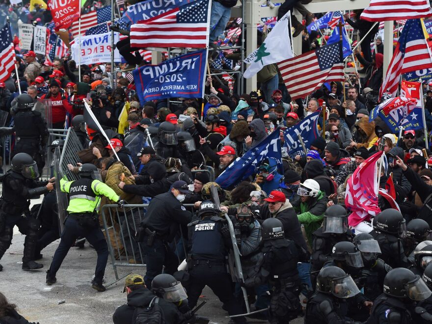 Trump supporters clash with police and security forces as they push down barricades to storm the U.S. Capitol. The Capitol Police officers are quickly overwhelmed.