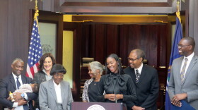 Michigan state Rep. Kyra Harris Bolden, center, speaks at the Michigan Hall of Justice in Lansing, Mich. on Tuesday, Nov. 22, 2022, after Gov. Gretchen Whitmer announced her appointment in 2023 to a state Supreme Court seat that will be vacated at the end of the year with Justice Bridget McCormack’s retirement. (Joey Cappelletti/Report for America via AP)