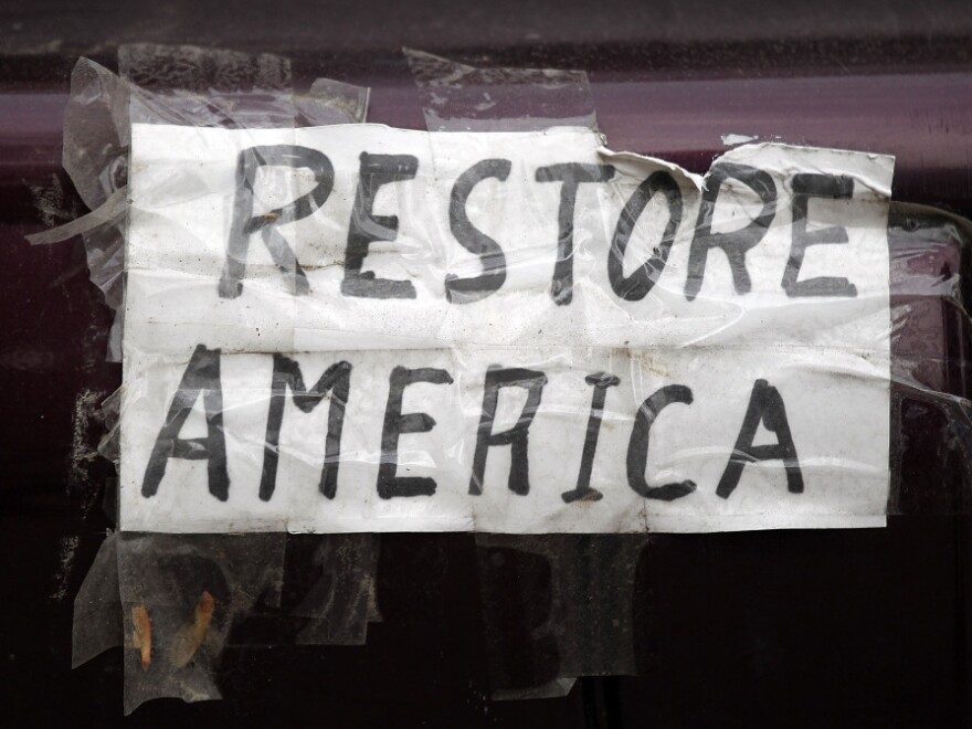 A homemade bumper sticker on the back of a car during a Tea Party rally in Concord, N.H., Romney appeared on Sept. 4.