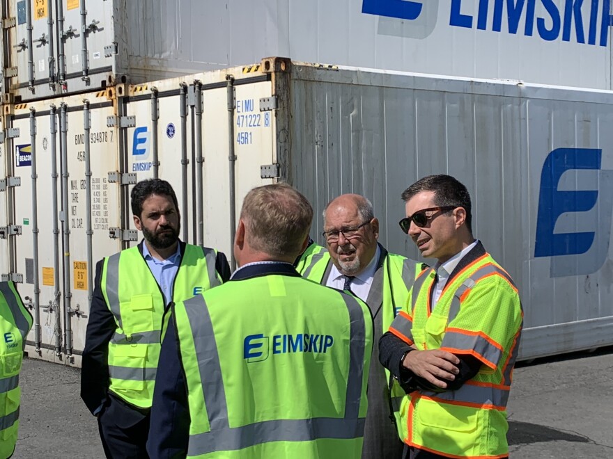 U.S. Transportation Secretary Pete Buttigieg meets with state and local officials, including Mayor Mark Dion, at the Portland International Marine Terminal on August 7, 2024.